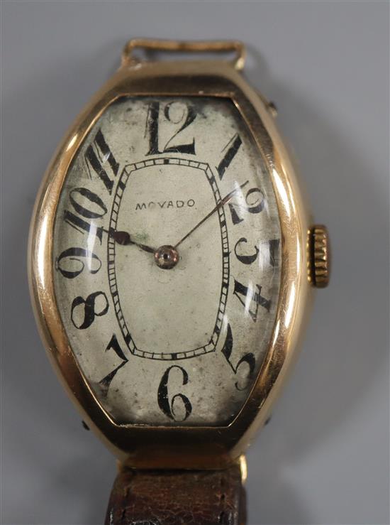 A stylish 1930s? yellow metal Movado manual wind wrist watch, with tumbling numerals, (a.f.),